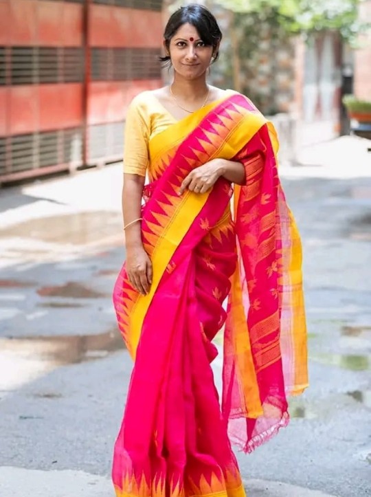 রানী গোলাপি হলুদ পাড়ের  সিলেটের ঐতিহ্যবাহী অরিজিনাল হ্যান্ডলুম কটন শিউলী ফুল মোটিফ শাড়ি